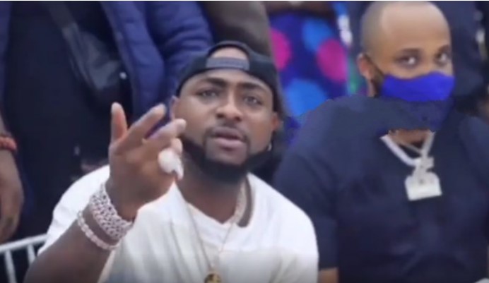 Moment Davido Angrily Signaled to A Fan To Cease Recording Him Whereas Eating, Explore