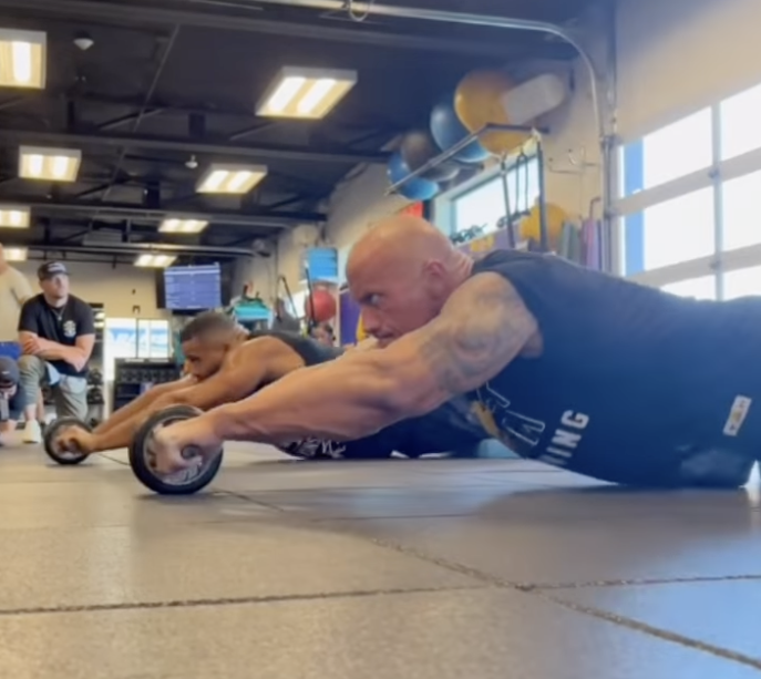 Watch The Rock Do a Killer Core Exercise With NFL Participant Aaron Donald