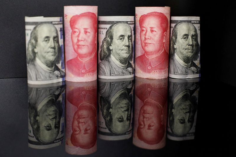 Evaluation-Chinese language corporations dangle onto {dollars}, hedge to arrange for unstable yuan