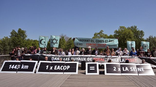 Non secular figures, local weather activists stage Paris protest towards Whole initiatives in Africa