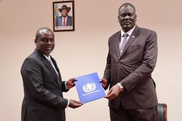 WHO Consultant, Dr Humphrey Karamagi, presents his letter of credentials to Honorable Ramadan Mohamed Abdallah Goc, Minister of International Affairs and Worldwide Company, South Sudan