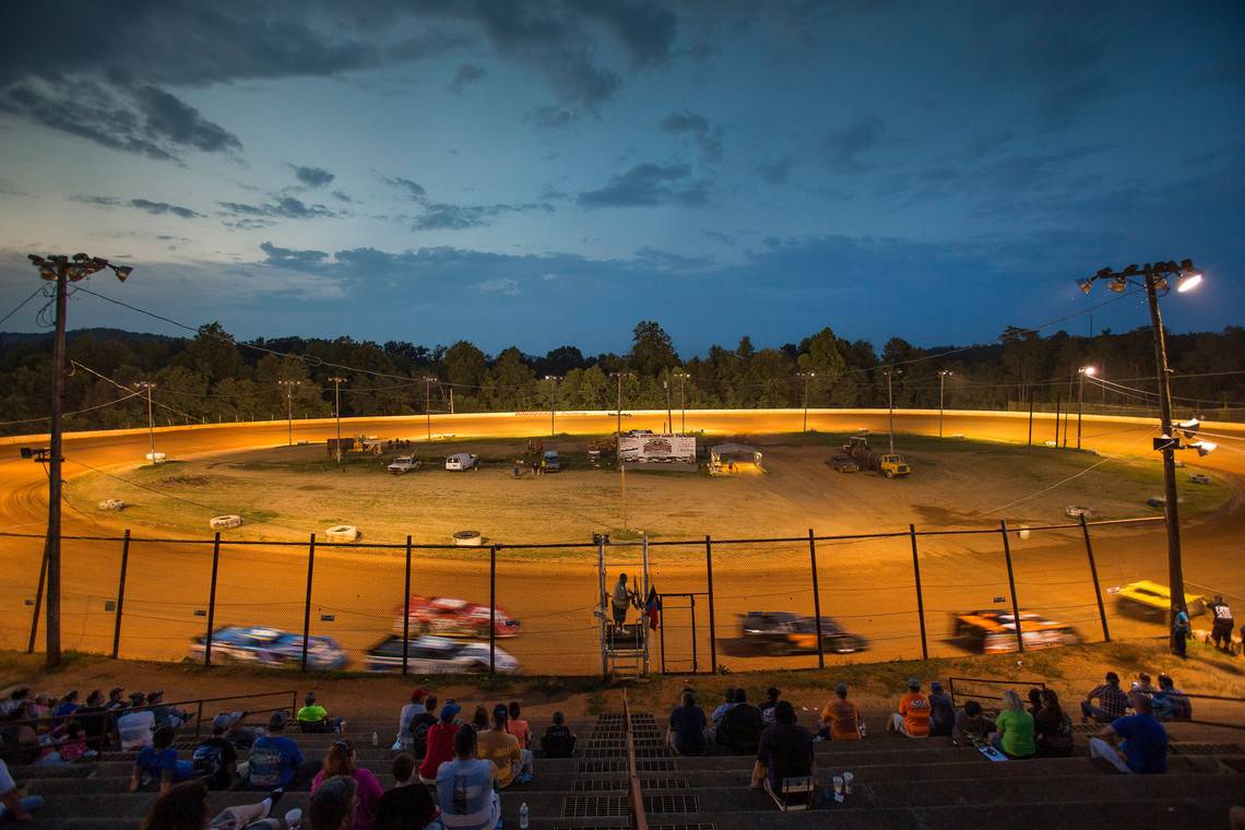 Automobile flips over fence at Ky. racetrack, sending a number of spectators to hospital