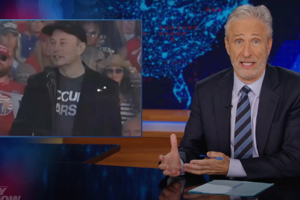 Jon Stewart Slams Elon Musk’s Trump Rally Look, Second Modification Rhetoric: ‘Weapons Don’t Defend Our Free Speech’