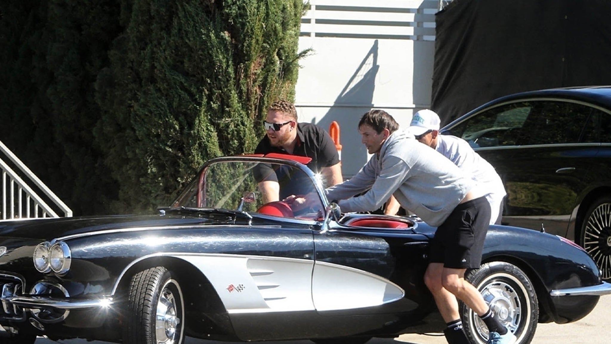 Ashton Kutcher’s Traditional Corvette Breaks Down, Will get Out and Pushes