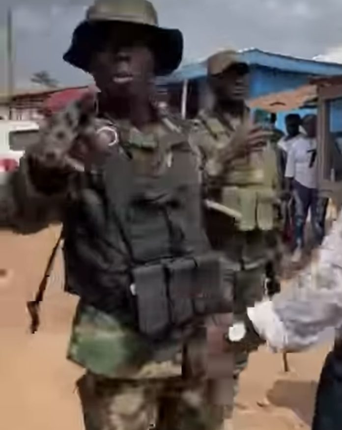 Elections 2024 – [Video] NDC Officer Clashes With Armed Troopers To Cease Them From Storming Polling Station