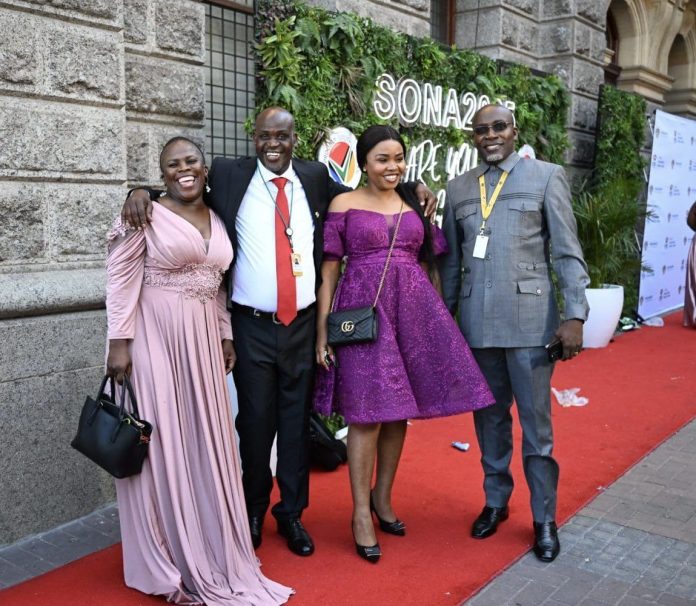 SONA attendees supporting native with their purple carpet outfits