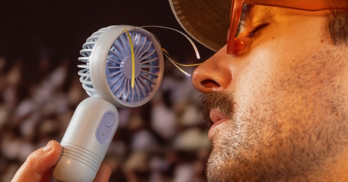 The hottest fashion accessory right now will make you super cool: mini portable fans
