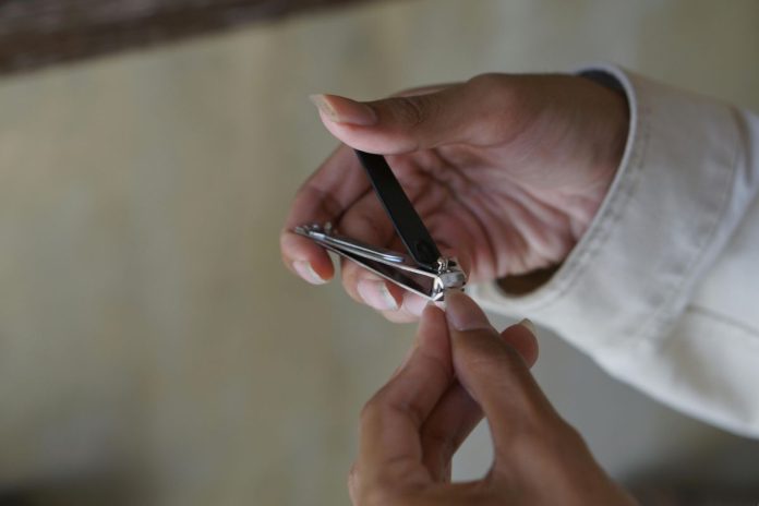 WATCH: Store staff forced to cut long nails at work