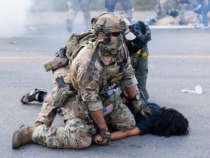 Using helicopters and chemical agents, immigration agents become increasingly aggressive in Chicago