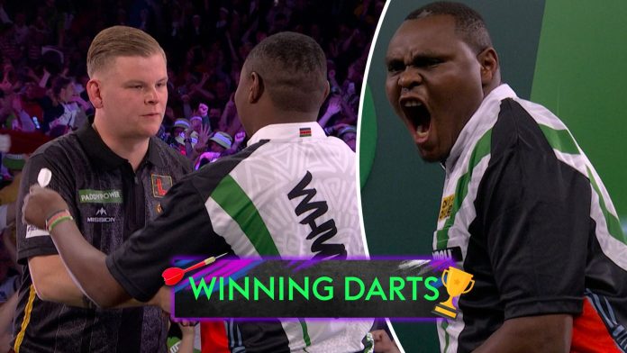 ‘One of the BIGGEST shocks!’ | Wild celebrations as David Munyua beats Mike De Decker at World Darts Championships!