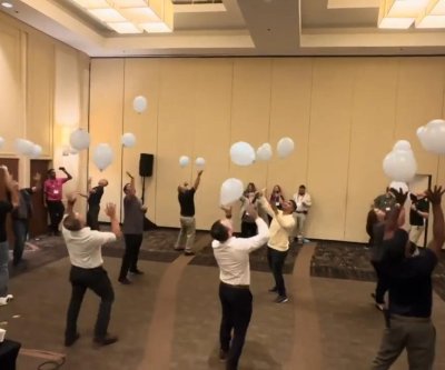 Watch: 12 tech workers keep 25 balloons in the air for one minute
