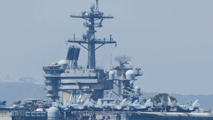 BREAKING: US carrier shoots down Iranian drone as tensions with Iran escalate